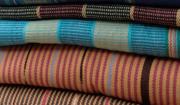 A stack of Tenun weave cloths by Torajamelo