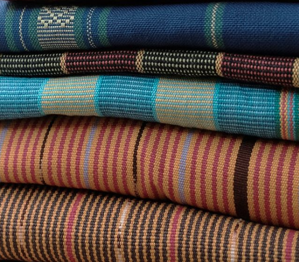 A stack of Tenun weave cloths by Torajamelo