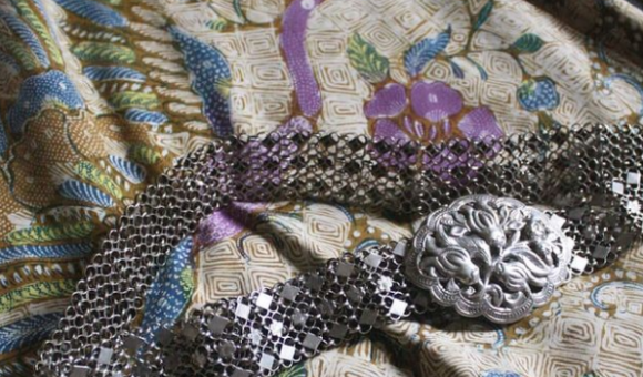 Batik Tiga Negeri with a belt with carved silver buckle.