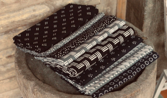 A stack of monochromatic black and white batik cloth.